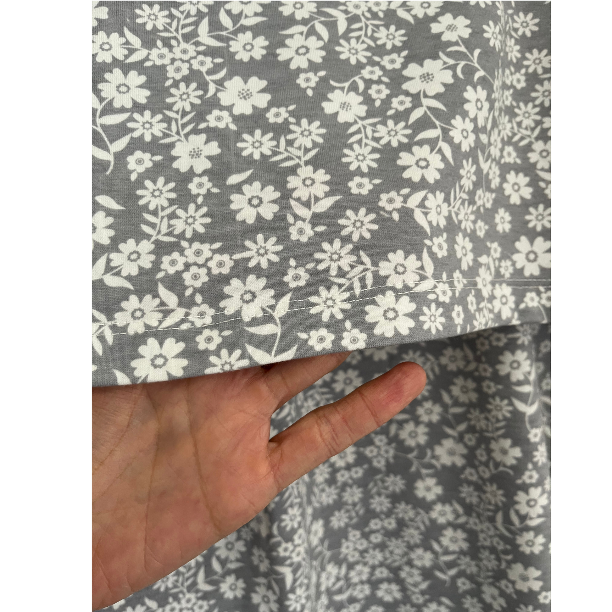 Close-up of hidden nursing access in gray floral breastfeeding nursing top, showing double-layer design for discreet breastfeeding.