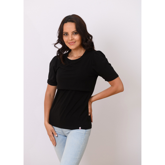 Woman wearing black breastfeeding nursing top with pouf sleeves and front-layered design for discreet nursing and pumping.