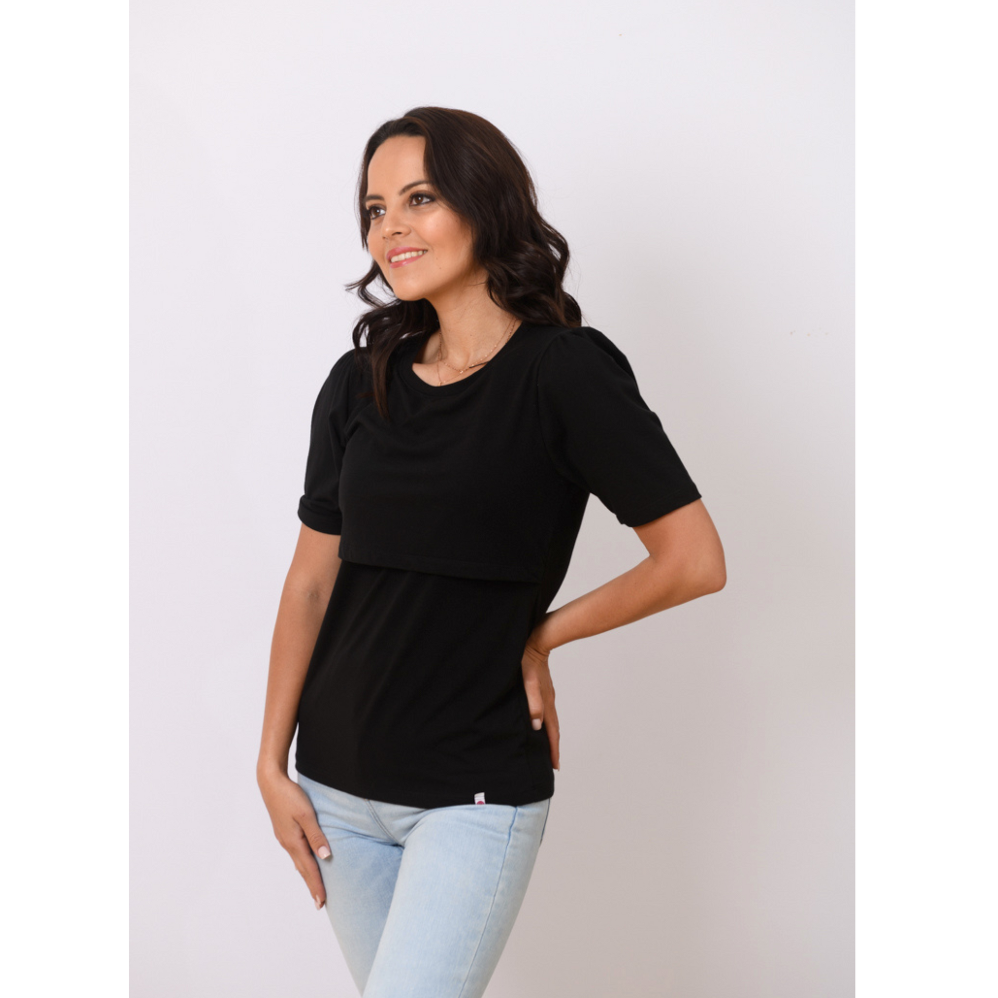Side view of black breastfeeding nursing top with pouf sleeves, front-layered nursing access, and soft breathable fabric.