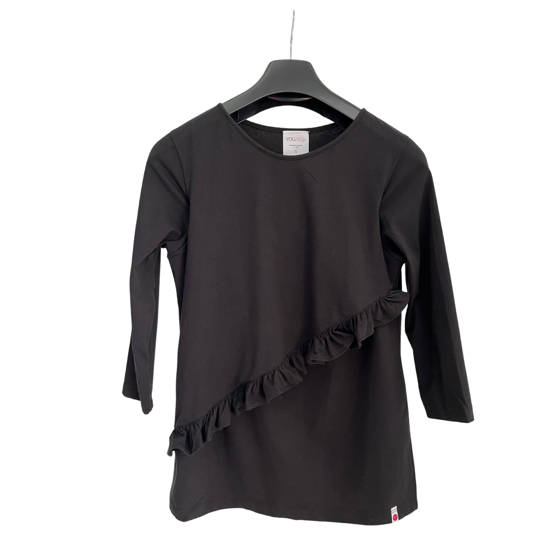 Black breastfeeding nursing top with front-layered nursing access and diagonal ruffle detail, displayed on hanger.